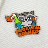 100% soft problem solver enamel pin on fabric background colorful raccoon pin