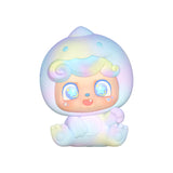 Close-up of pastel-colored Q Kid figure in sitting pose with starry eyes.