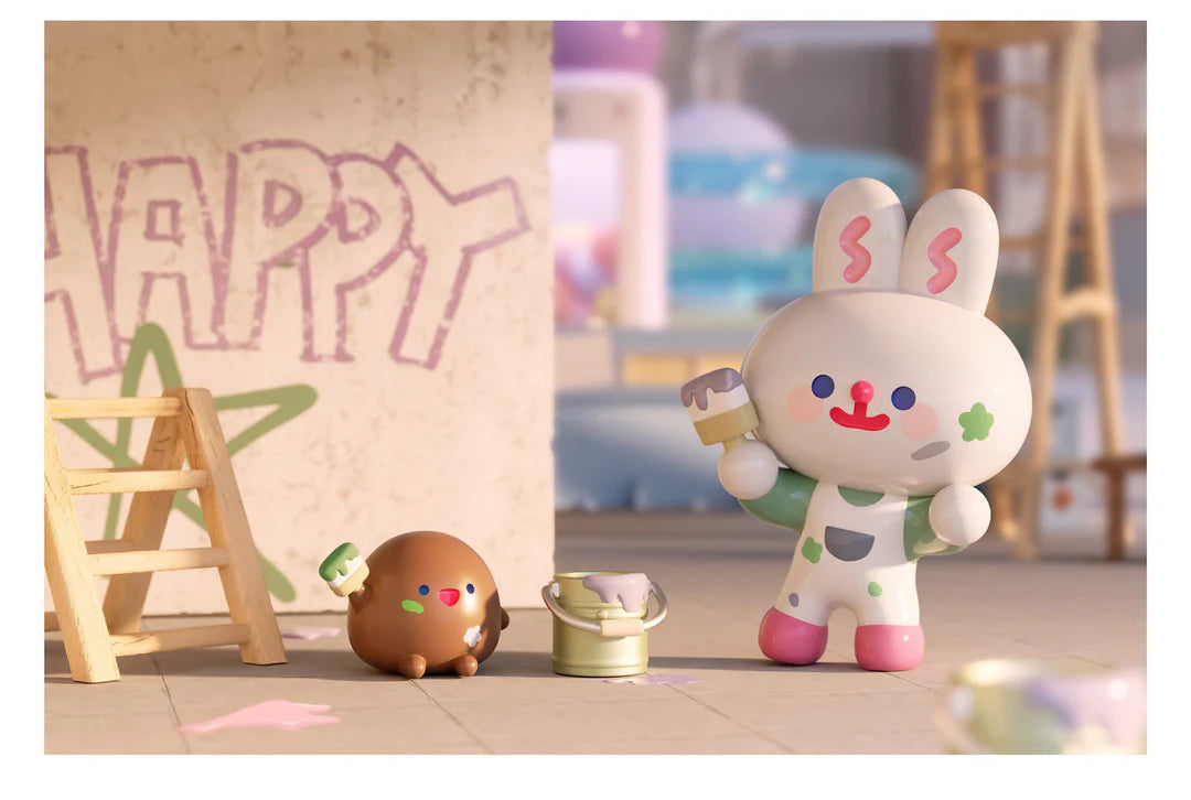 Worky Tokky and Worky Lucky figures painting inside the Happy Factory