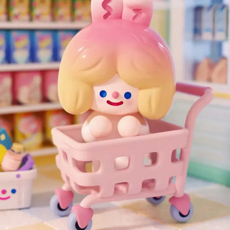 Cart Rider RiCO collectible figure riding inside a pink shopping cart at Coco Mart