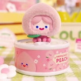 Peach Cell RiCO collectible figure emerging from a peach-themed can