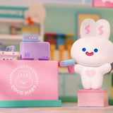 Counter Master Snow Coco Mart mascot figure standing beside a checkout counter