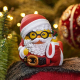 Santa Claus TUBBZ collectible duck figure lying in classic red suit with white beard and glasses.