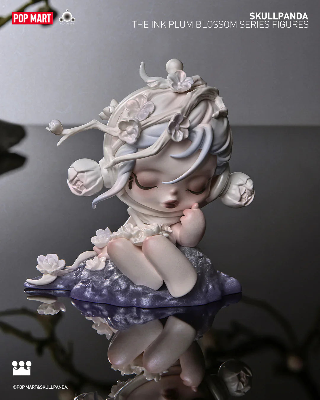Skullpanda Ink Plum Blossom vinyl figure sitting peacefully with flower branches in hair, POP MART collectible.