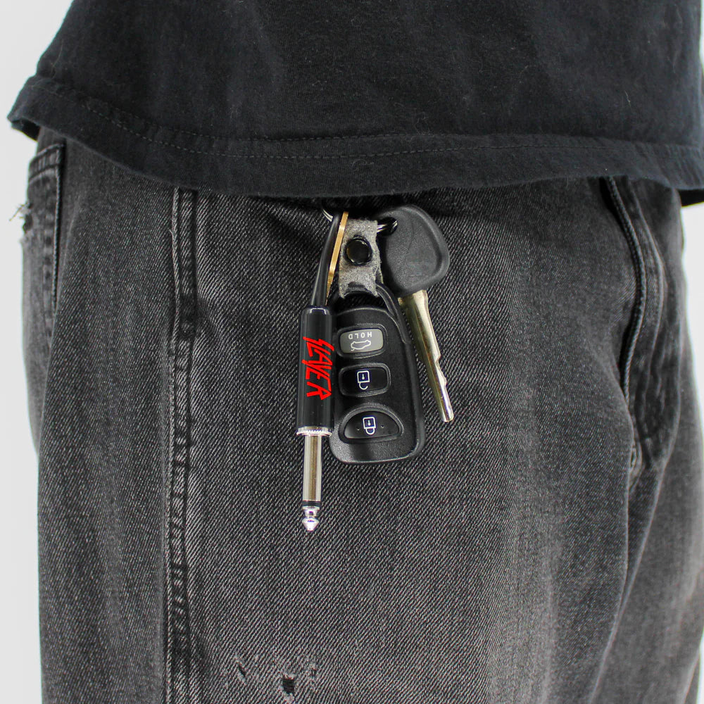 Slayer plug keychain attached to keys in pocket
