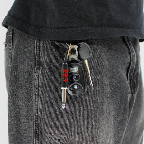 Slayer plug keychain attached to keys in pocket