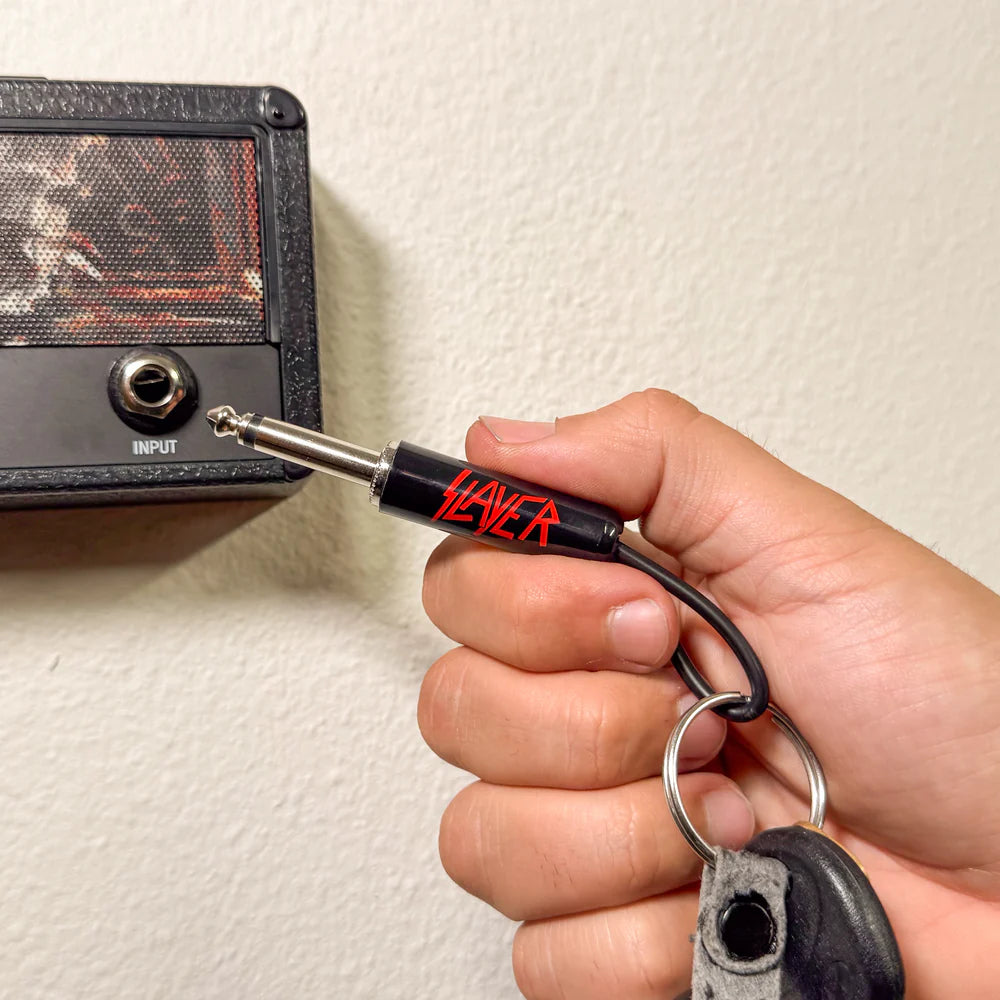 Slayer plug keychain inserted into amplifier input jack