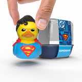 Hand holding the Superman Mini TUBBZ duck figure above the packaging.