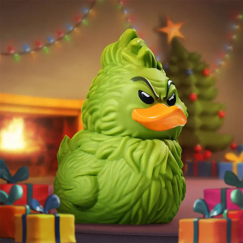 The Grinch TUBBZ duck collectible surrounded by holiday gifts