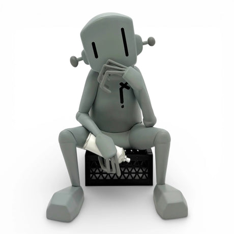 chrisrwk the thinker vinyl figure front view robot sitting crate