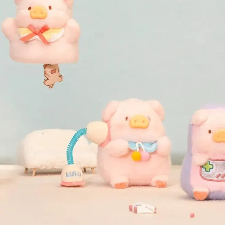 LuLu The Piggy plush holding a toy phone beside gaming-themed and gift-themed characters