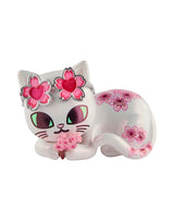 tokidoki cherry blossom cat laying down with cherry blossom glasses