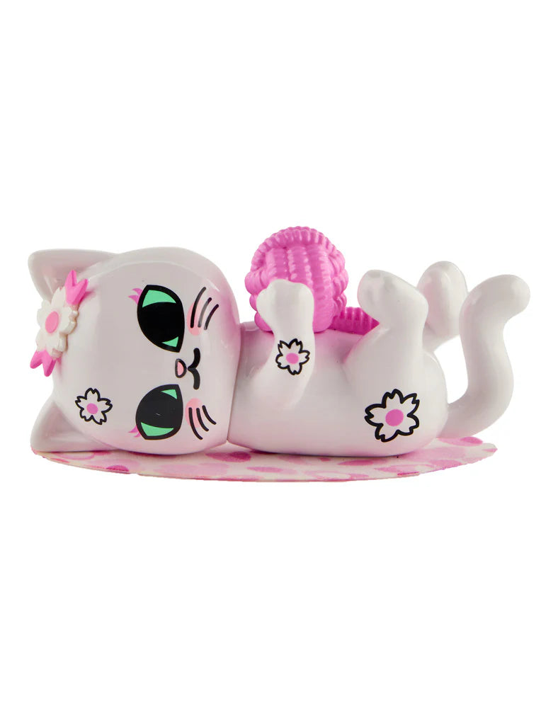 tokidoki cherry blossom cat lying on back playing with toy