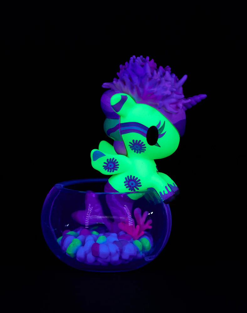 Tokidoki Neon Reef Mermicorno neon yellow coral variant glowing under blacklight