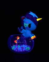 Tokidoki Mermicorno Neon Reef figure Neon Green Coral with purple coral mane glowing under blacklight in a bowl display.