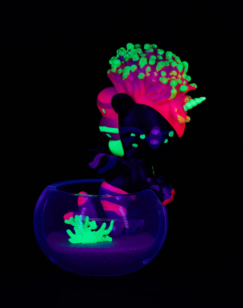 Tokidoki Mermicorno Neon Reef figure Groovy Coral glowing under blacklight with bright starfish detail in bowl.