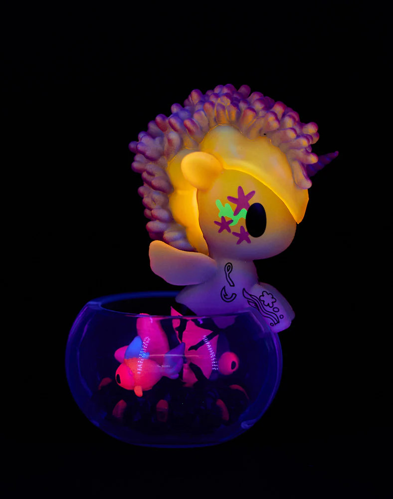 Tokidoki Mermicorno Neon Reef figure Dusty Pink Coral glowing neon pink and blue with coral reef display.