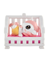 tokidoki Baby Unicorno Cuddles figure lying in pink baby crib