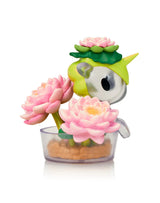 Tokidoki Botanical Harmony Unicorno blind box figure with pink lotus flowers in a clear plant pot