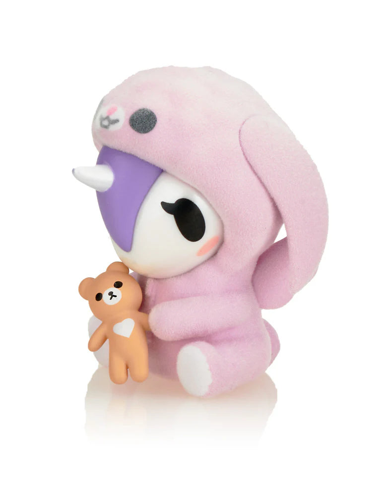 Cozy Unicorno blind box figure by tokidoki cuddling teddy bear