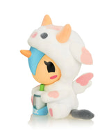 Cozy Unicorno blind box figure by tokidoki drinking milk in cow pajamas