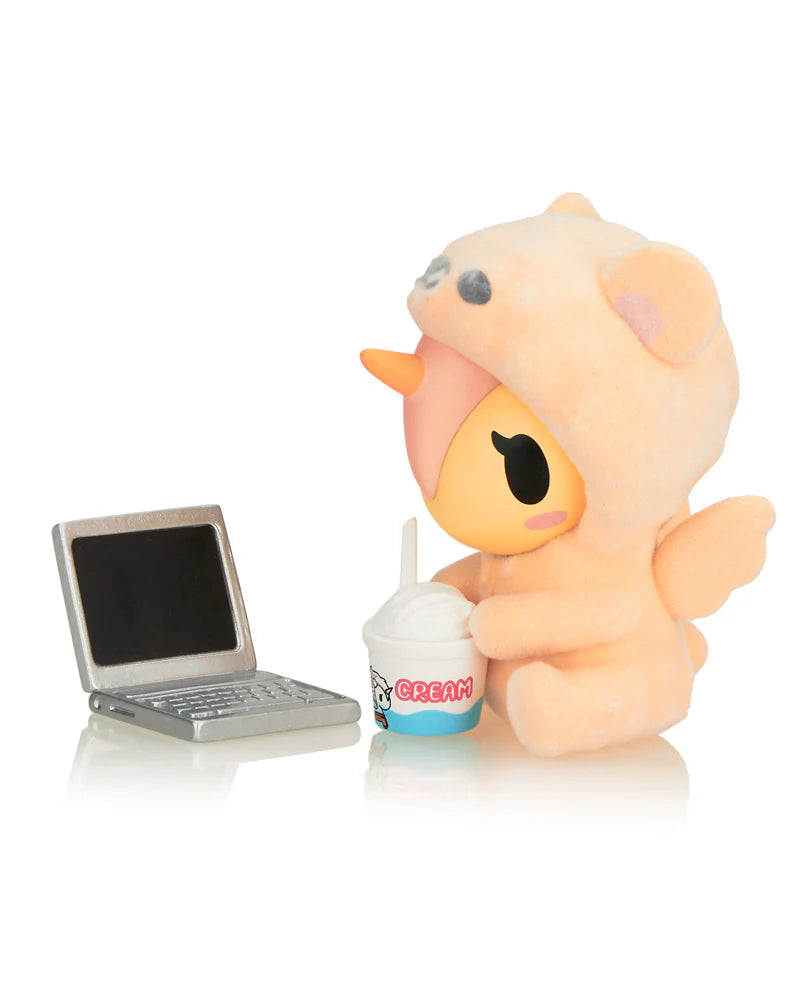 Cozy Unicorno vinyl figure by tokidoki with laptop and ice cream