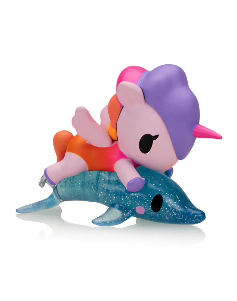 Fun in the Sun Unicorno figure riding a sparkling blue dolphin