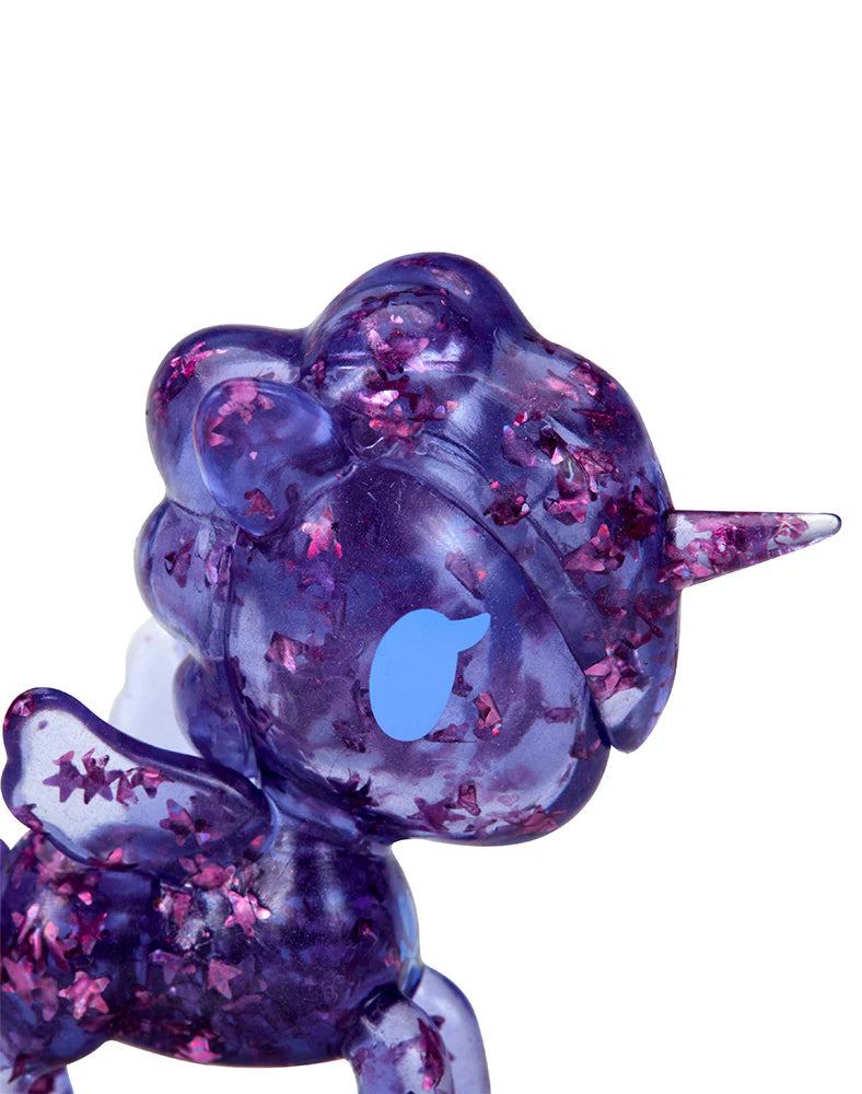Purple translucent Unicorno Lite Shimmer Glitter figure with pink star-shaped glitter