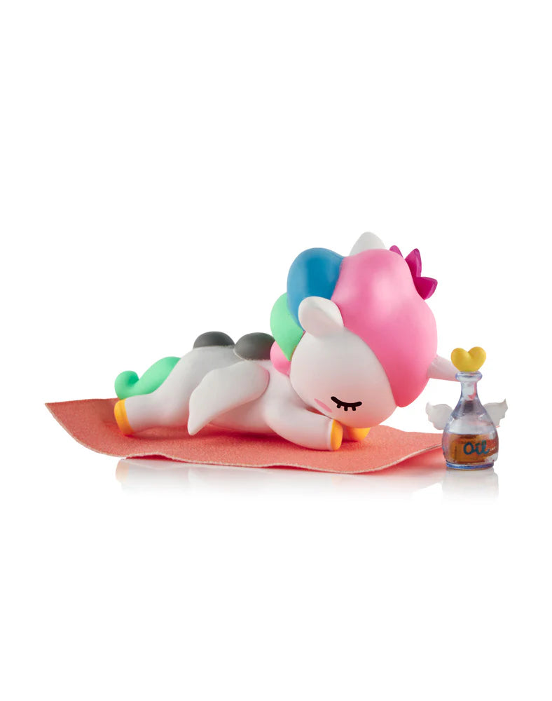 Spa Day Unicorno figure relaxing on towel with oil bottle tokidoki blind box