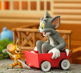 Tom & Jerry collectible figure of Jerry pulling Tom in a red wagon from Best Friend's Day blind box series