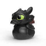 Close-up of Toothless Mini TUBBZ figure with textured black scales and green eyes.
