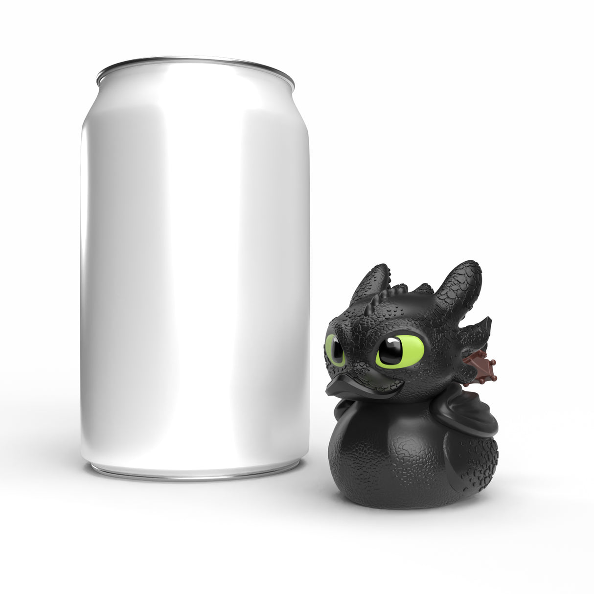 Toothless Mini TUBBZ figure displayed next to a soda can for size comparison.
