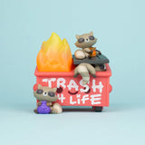 Trash Panda Dumpster Fire vinyl figure front view with raccoons climbing on a graffiti-covered red dumpster