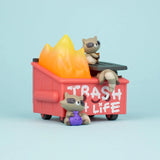 Close-up of Trash Panda Dumpster Fire vinyl figure showing raccoon and flame sculpt details
