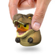 Hand holding the Mini T-Rex TUBBZ duck figure to show size.