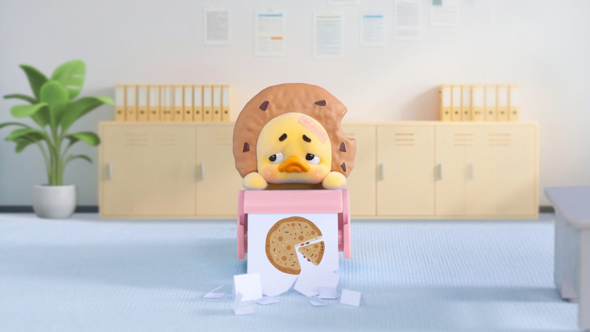 Upset Duck cookie head mood vinyl figure sitting at desk with pizza illustration