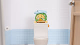 Upset Duck bathroom mood vinyl figure sitting on toilet display setup