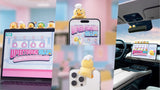 Upset Duck vinyl figure clipped to smartphone screen as status display accessory