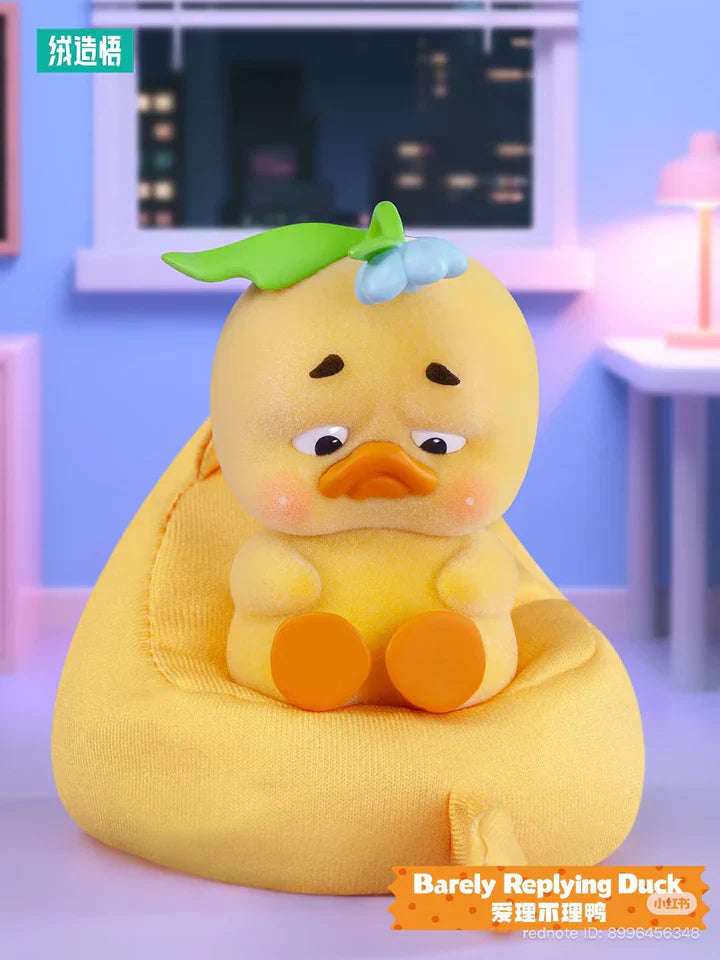Barely Replying Duck sitting on beanbag from Upset Duck Stop the Spiral Duck designer plush series.
