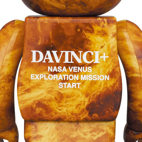 Rear view of Bearbrick Venus figure showing “DAVINCI+ NASA VENUS EXPLORATION MISSION START” print