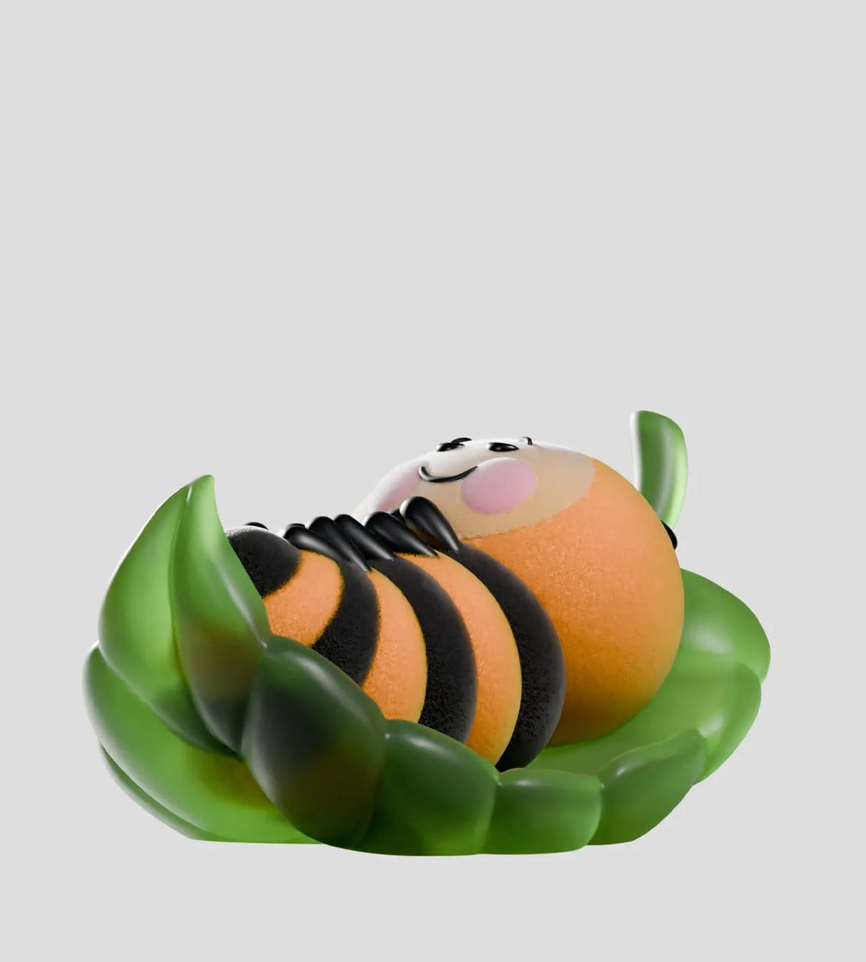 Orange and black Wooly Bear caterpillar resting on green leaves