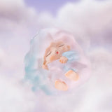 Pastel blue and pink cloud Yumo figure sleeping peacefully.
