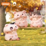 Pink pig Yumo figures relaxing on swing and grass under autumn trees.