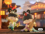 Snake themed zZoton figures performing traditional music and dance during Lunar New Year celebrations